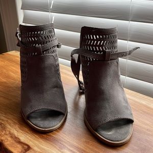 Gray suede ankle strap shoes.